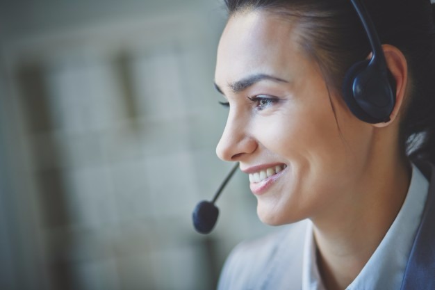 gallery/smiling-executive-using-headset_1098-527